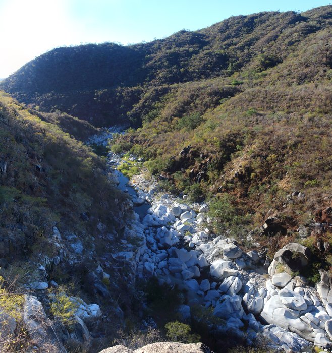 A river gorge is cut through a fluvial terrace - possibly recording the change in water abundance between the wetter ice-age and the modern desert hit on occasion by major floods.