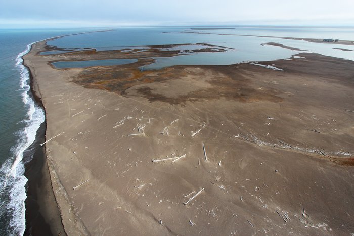 Alaska's arctic coast is largely fringed by long barrier spits that are overwashed by storms.
