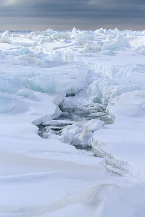 Storm waves cracked several foot thick ice along the Bering Sea Coast.