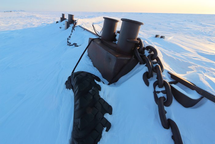 This shipwrecked barge, shrouded in ice and wind-packed snow, provided us with shelter for two days.