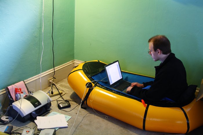 We'd given away all our furniture, but Hig still hadn't finished his dissertation.  The packraft was the best place for working.
