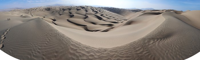 Giant dunes sweep inland from the coast in Peru's coastal desert.