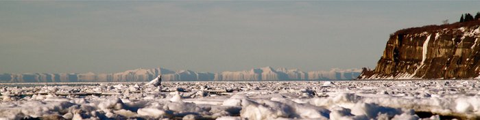 Looking through sea ice across Cook Inlet to a Fata Morgana distortion.