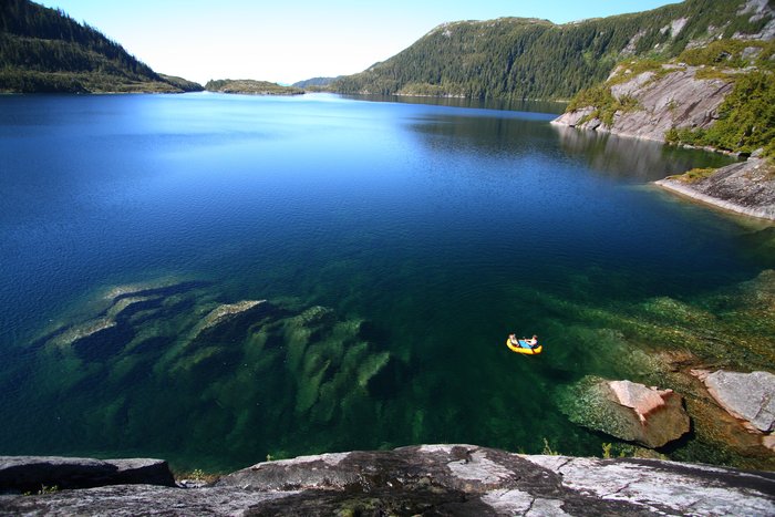In a remote alpine lake, packrafts float over the clearest water I've ever seen.