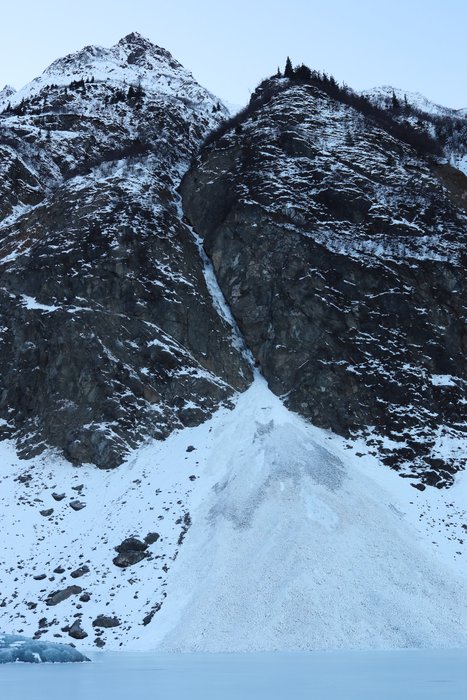 The base of a 2600 foot cliff, as viewed from the ice on Grewingk Lake.