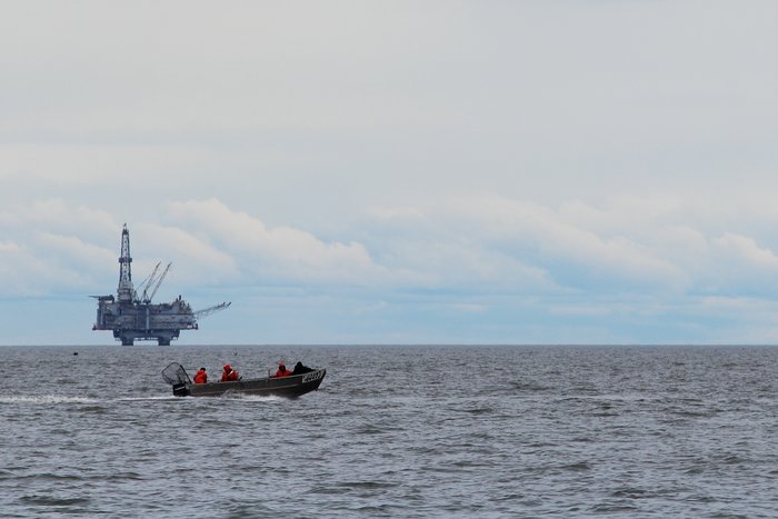 A set net fishing skiff heads off to cross Cook Inlet.