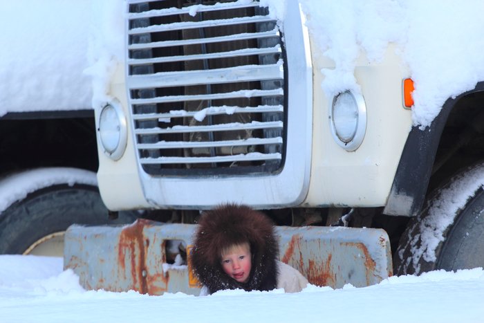 Katmai posing by a large dump truck