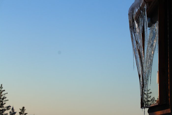 Icicles decorate the windows of the yurt.