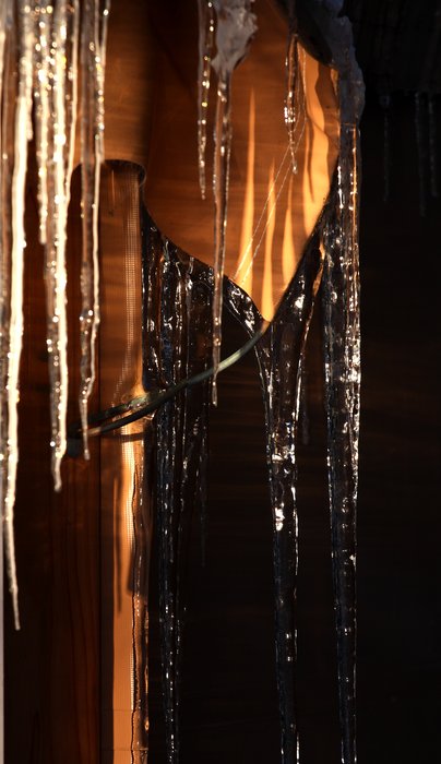 Icicles decorate the windows of the yurt.