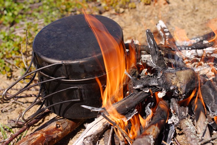 Cooking fire on the edge of a tundra lake.
