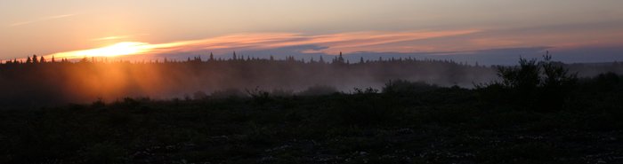 Mist rises from a tundra lake at sunrise, near the Kvichak River.
