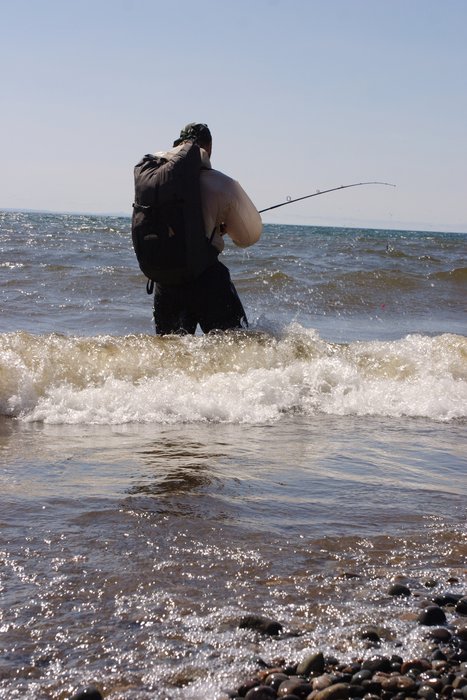 Tom fishing in the surf on Lake Iliamna.