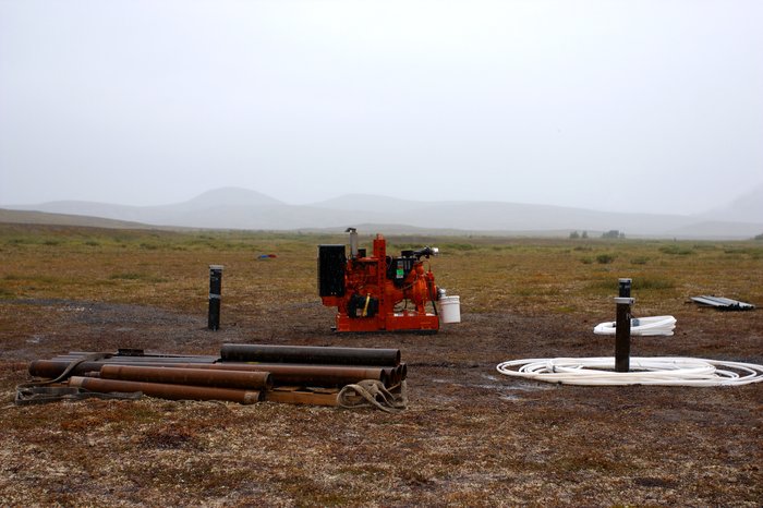 Small deposits of equipment were scattered across the tundra throughout the site. Tailings lake area.