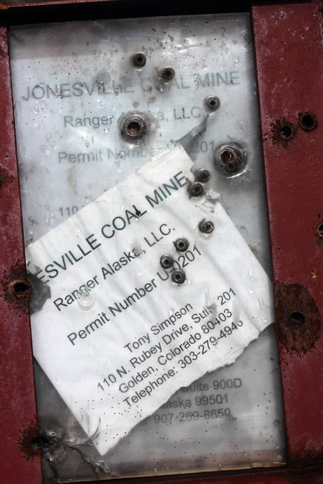 A permit sign near Jonesville Coal mine has been peppered by bullets.