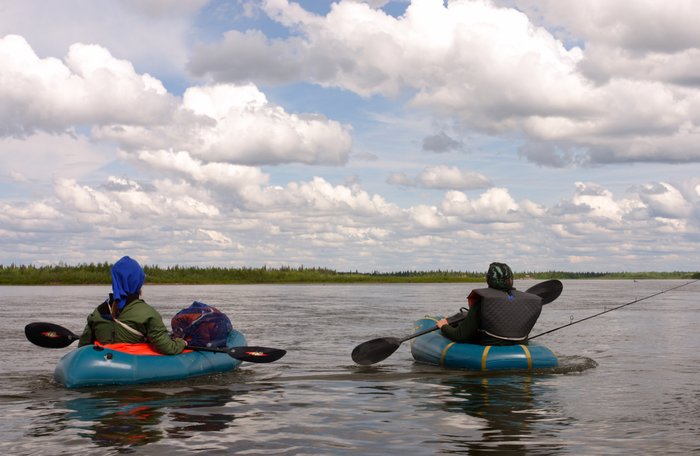 Hig and Tom in the Alpacka rafts, under a sky of puffy clouds on the Nushagak River. 