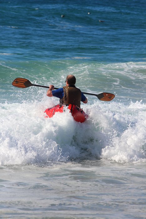 Trying to get off a beach in breaking waves is hard in a packraft, but that doesn't mean you shouldn't try.