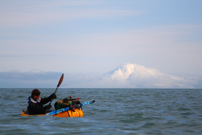 On the coast in the winter, our <a href="http://www.groundtruthtrekking.org/Journeys/WildCoast.html">packrafts brought us around the headlands</a>, with skis strapped to the front.  Mt. Augustine provided the backdrop.