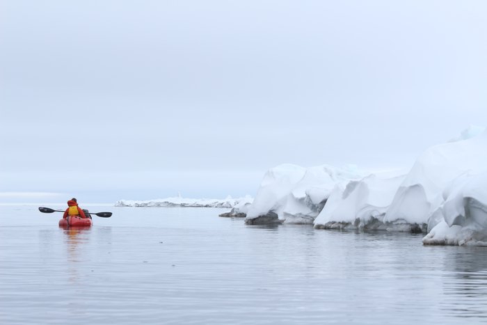 Calm weather and open water beyond the edge of shore-fast ice provide a beautiful paddling day.