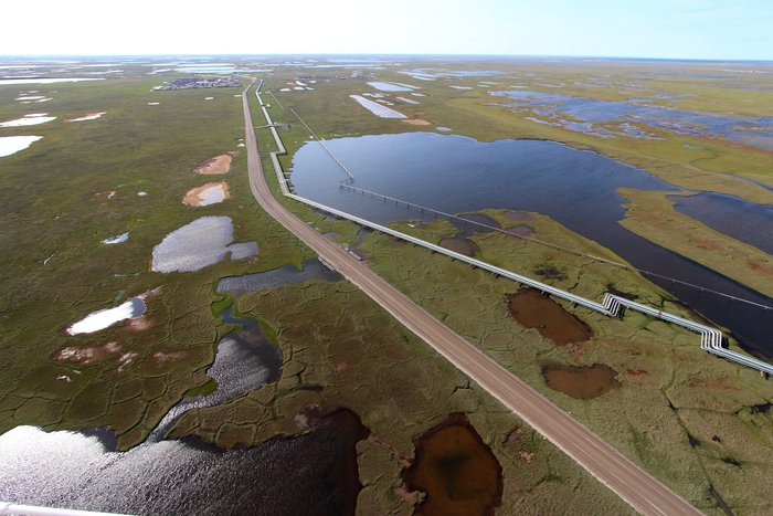 Pipelines for transporting oil from drill pads on Alaska's North Slope thread their way around myriad lakes, or in some cases cross them, attempting to minimize the route length over the tundra.  The distinctive right-angle bends in the pipeline allow it to flex as temperature varies by over 100 degrees F.