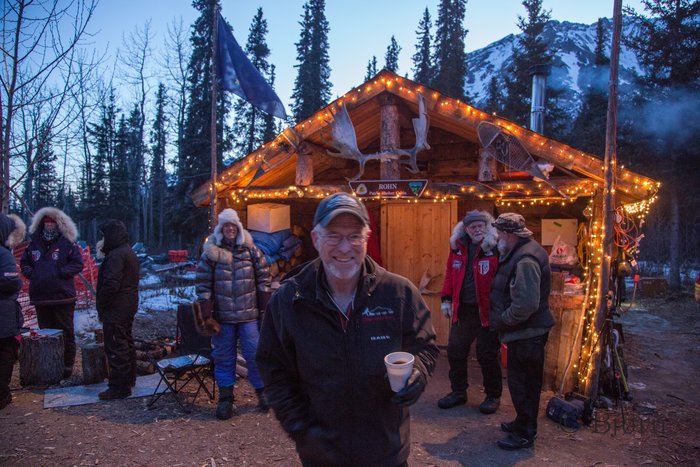 Jeff King pauses in front of the Rohn cabin during the 2014 Iditarod Sled Dog Race. 2014 was a particularrly tough year for dog mushers racing the Iditarod. 