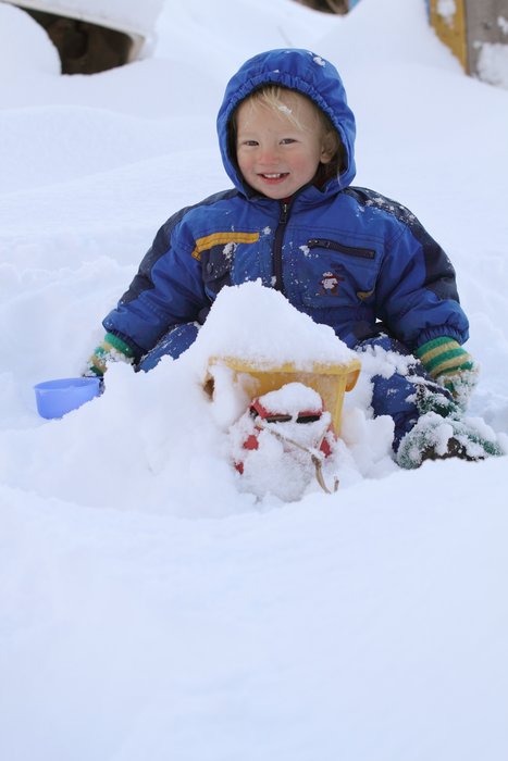 Katmai loads his dumptruck with snow.