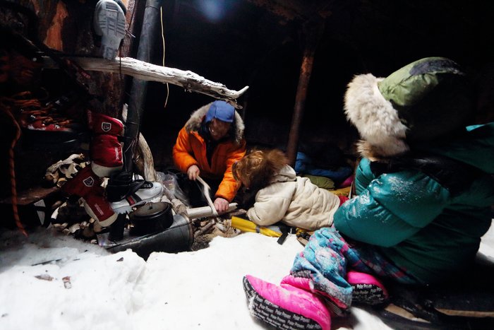 We climbed into the hold of a shipwrecked barge buried in snow and ice to wait out a storm.