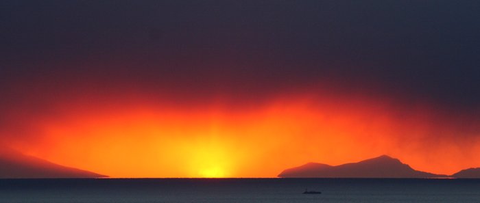 A brilliant sunset behind a ship on it's way into Cook Inlet.