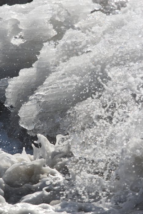 Waves break across ice belched into the ocean as the Kasilof River broke up in the spring.