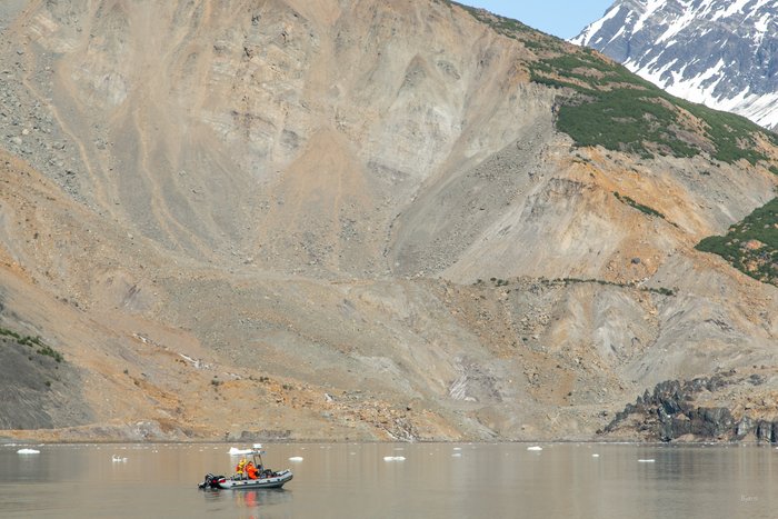 The National Park Service skiff under the landslide gives some perspective to the size of the slide.