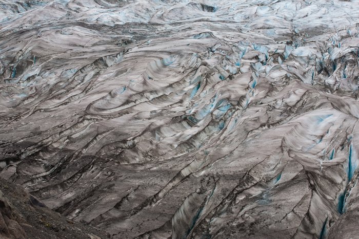 Besides the beautiful shape of the surface of the glacier, bands of collected sediment can be seen striping the length of the glacier.  Calving face is towards the right of this image.